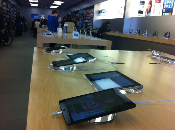 A Customer at an Apple Store Looking at His IPhone while Waiting at an Apple  Store Editorial Photo - Image of imac, computer: 237668441